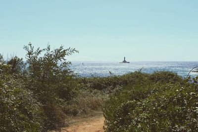 Scenic view of calm sea against blue sky