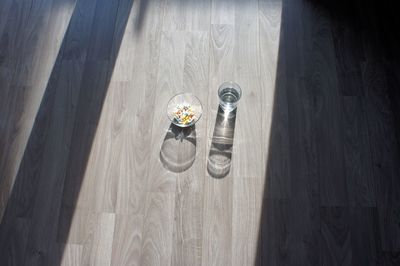 High angle view of shoes on hardwood floor