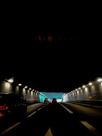 People in illuminated tunnel