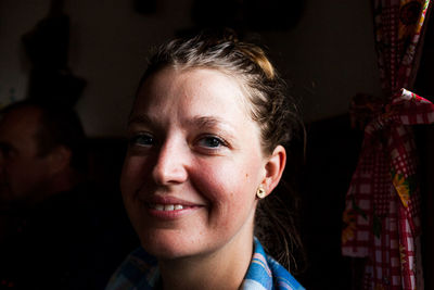 Close-up portrait of a smiling young woman
