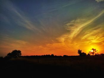 Scenic view of landscape at sunset