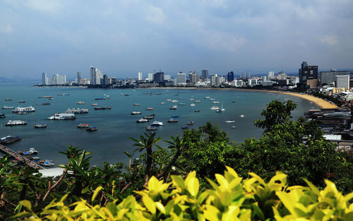 Scenic view of sea and buildings against sky