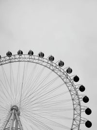 Low angle view of ferris wheel against sky