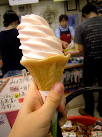 Midsection of woman holding ice cream