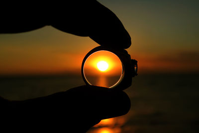 Close-up of hand holding sun