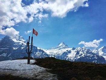 Scenic view of snowcapped mountains against sky