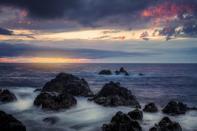 Scenic view of sea against sky during sunset