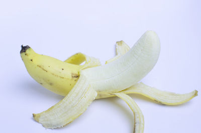 Close-up of bananas against white background