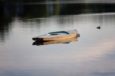 Boat moored in lake