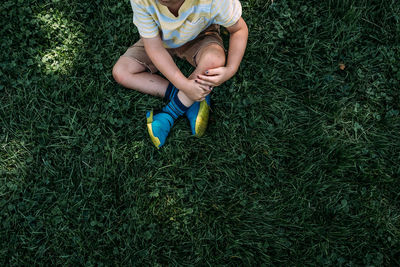 Low section of child on field