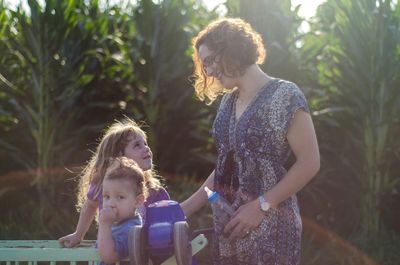 Mother with daughters in garden