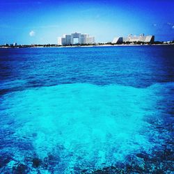 Scenic view of sea against blue sky