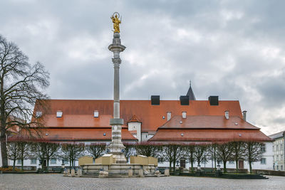 Buildings against sky in city during winter