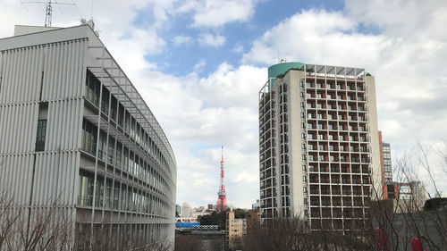 Low angle view of modern buildings against sky in city