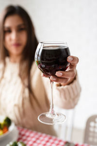 Portrait of woman holding wineglass