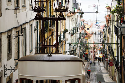 Tram and cables on steep hill, lisbon, portugal