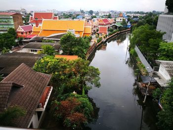 High angle view of houses in town against sky