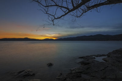 Scenic view of sea against sky at sunset