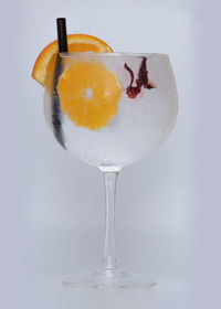 Close-up of drink on table against white background