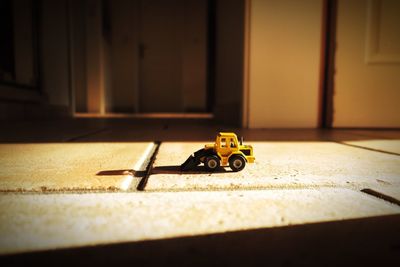 Toy earth mover on floor at home