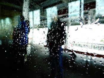 Raindrops on glass window in rainy season