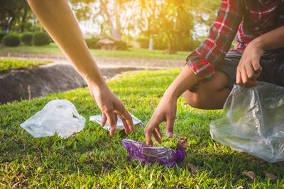 Midsection of woman holding ice cream in basket