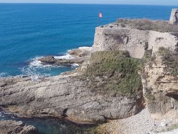 Scenic view of sea seen through rocks