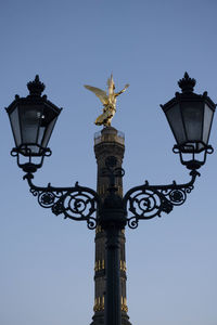 Low angle view of communications tower against sky