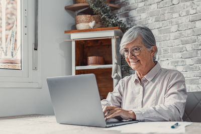 Young man using laptop at home