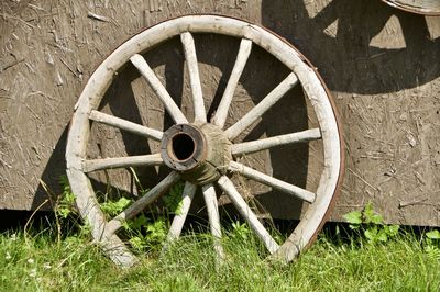 Old rusty wheel on field