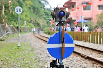 Close-up of road sign on railroad track