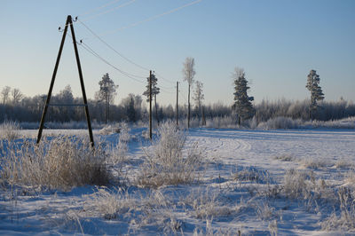 Scenic view of snow covered landscape against sky