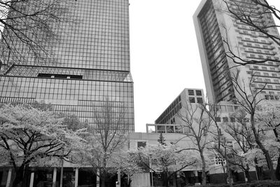 Low angle view of skyscrapers against clear sky