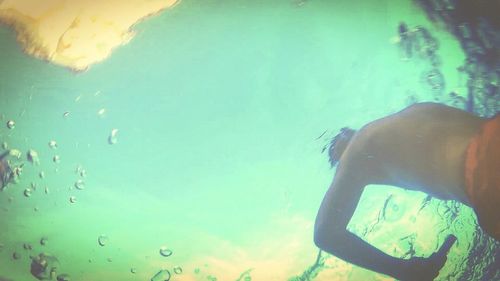 Close-up of woman with arms raised