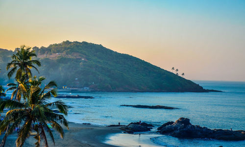 Scenic view of beach against sky during sunset