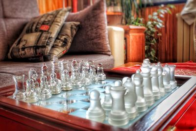 Full frame shot of chess pieces on table at home