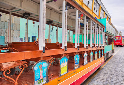 Multi colored boats moored in city