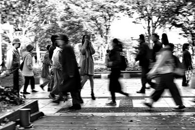 People on road in city