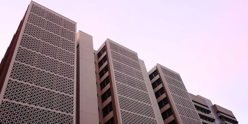 Low angle view of modern buildings against clear sky