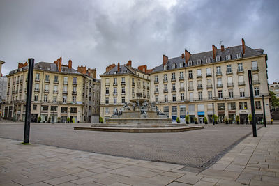 Buildings in city against sky