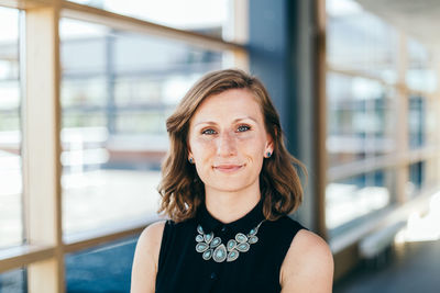 Portrait of confident young woman at home