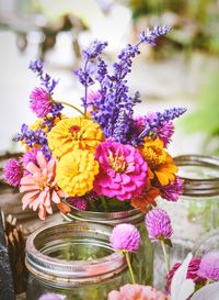 Close-up of purple flowering plants in jar