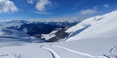 Scenic view of snowcapped mountains against sky