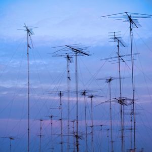 Low angle view of mast against sky at dusk