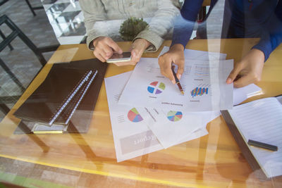 High angle view of people on table