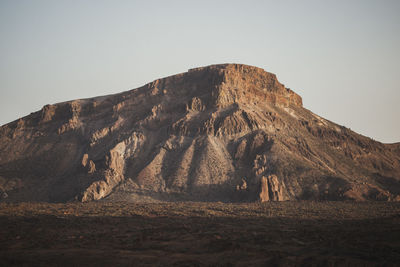 Scenic view of rocky mountains against clear sky
