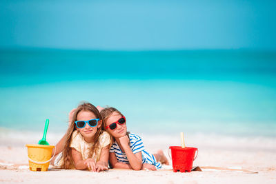 Portrait of woman with sunglasses on beach