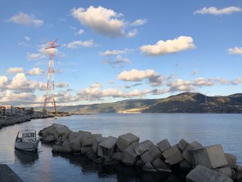 Sailboats on sea against sky