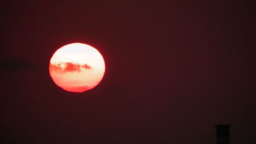 Low angle view of moon at sunset