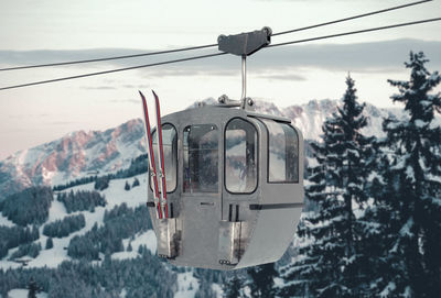 Overhead cable car on snowcapped mountain